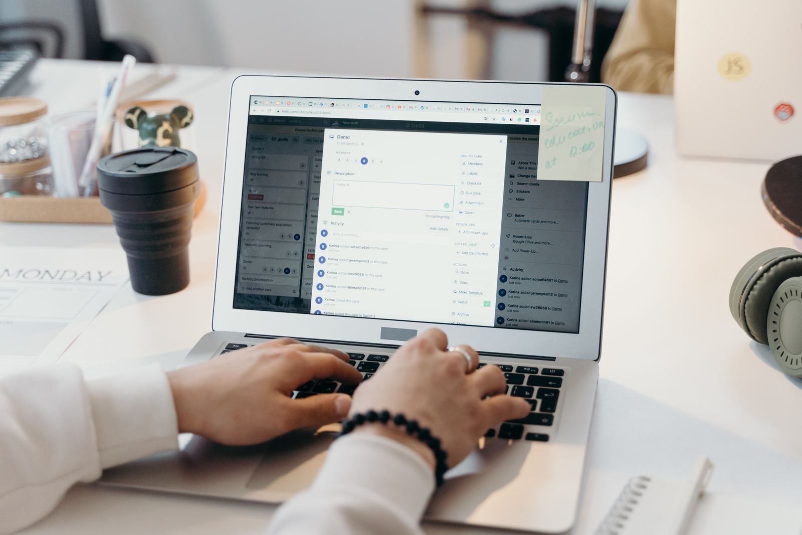 A person typing on a laptop at a desk, standing in for planning an outbound campaign to reach past customers.