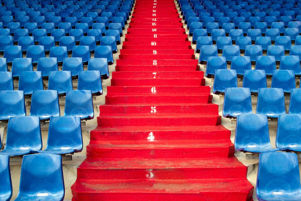 Numbered stadium stairs in strict order, standing in for the five AEO steps that only work followed in sequence.