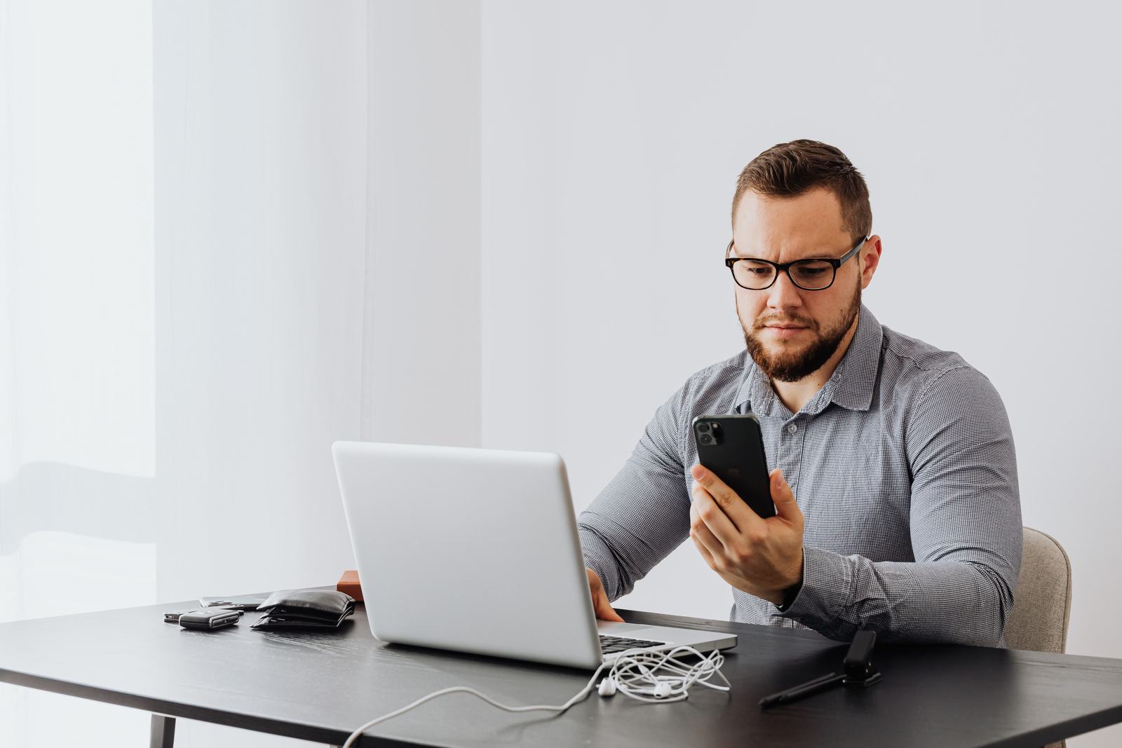 A business owner reading customer reviews on a laptop.